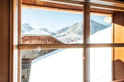 a window with a view of a mountain at Tlisöra Speckstube in Frena