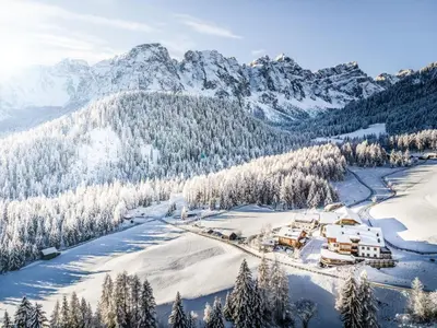 an aerial view of a resort in the mountains in the snow at Tlisöra Speckstube in Frena