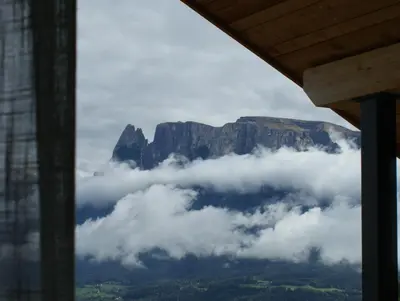 a view of the table mountain from a window at Alpenglow Apartments in Collalbo